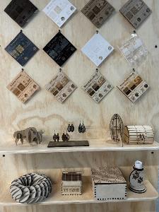 wood laser cut artifacts on display at the makerspace